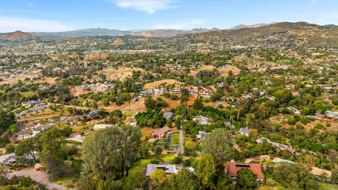 a view of a pathway with a wrought fence