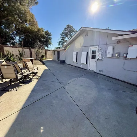 a view of a house with backyard