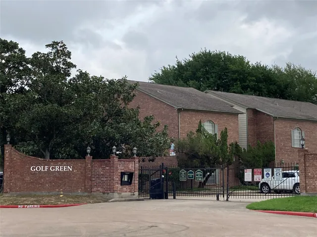 a view of a house with a yard and tree s