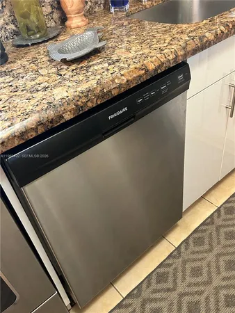 a kitchen with a stove and a refrigerator