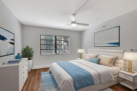 a bedroom with a large bed and a dresser