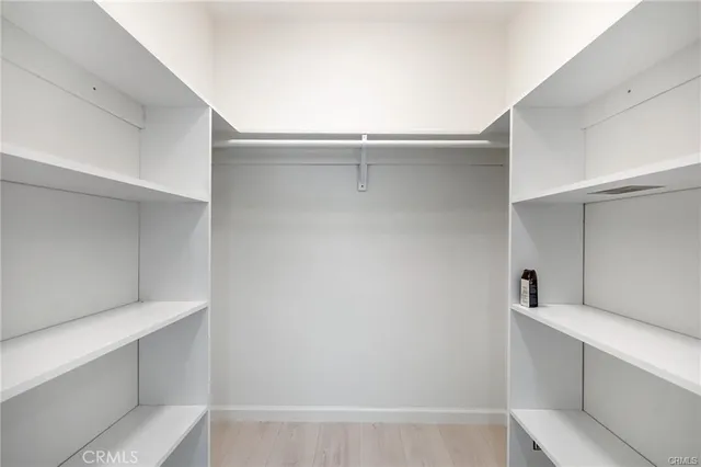 a view of an empty walk in closet