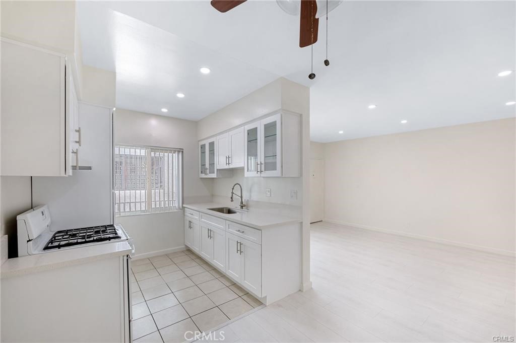 580 West Stocker Street, Unit 6 Glendale, CA 91202 - Photo 2 of 17 a kitchen with stainless steel appliances a sink stove and cabinets