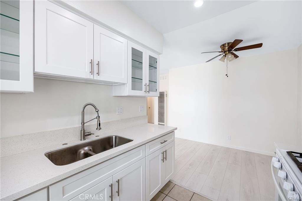 580 West Stocker Street, Unit 6 Glendale, CA 91202 - Photo 9 of 17 a kitchen with stainless steel appliances a sink a refrigerator and cabinets