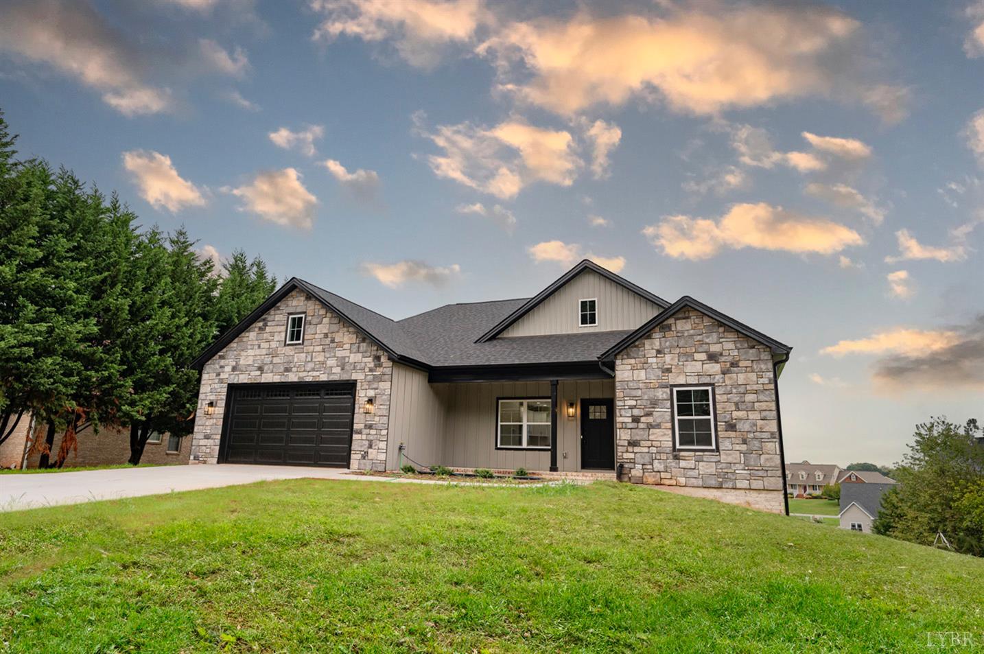 2067 Crockett Road Forest, VA 24551 - Photo 1 of 1 a front view of a house with a garden
