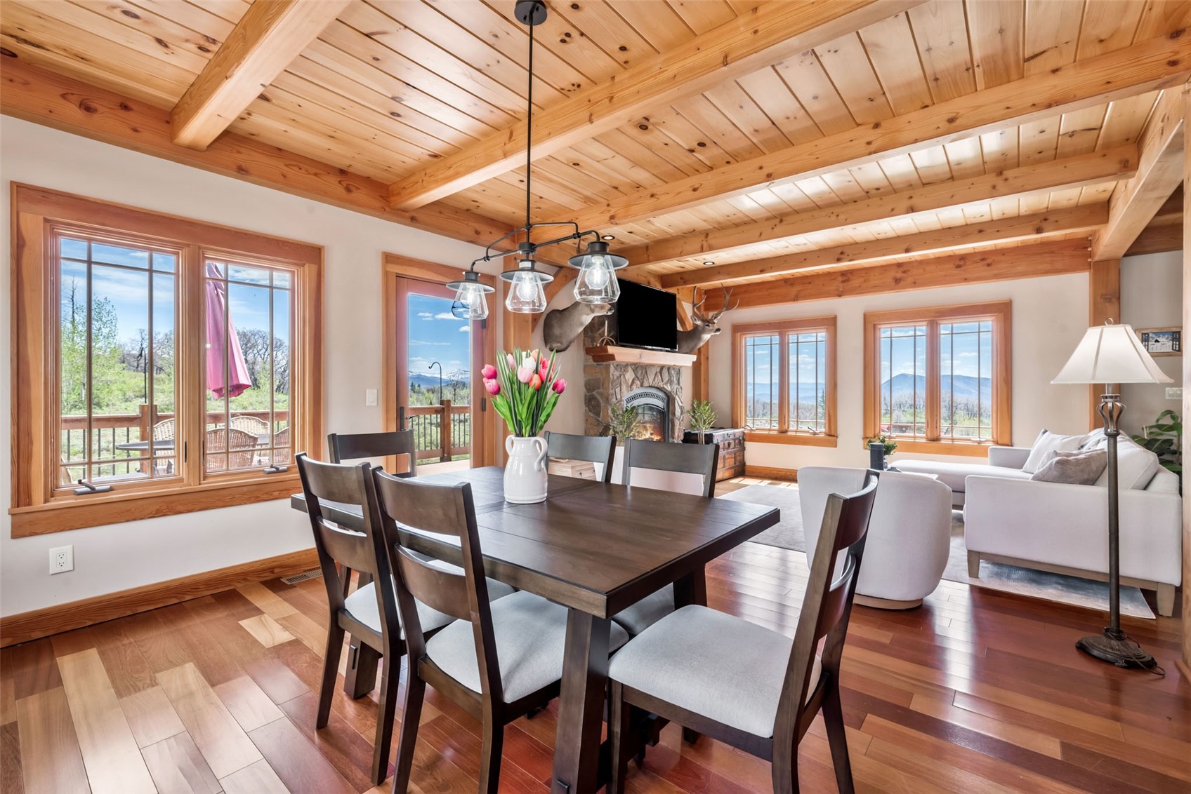 51193 Smith Creek Road Steamboat Springs, CO 80487 - Photo 14 of 48 a dining room with furniture window and wooden floor
