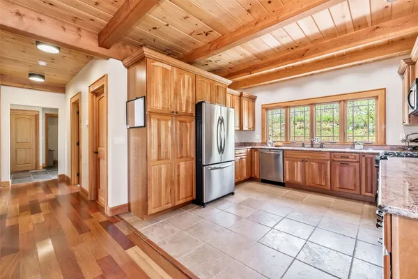 a kitchen with stainless steel appliances a refrigerator and a sink