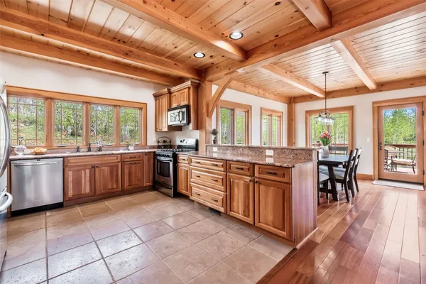 a large kitchen with a large window and counter space
