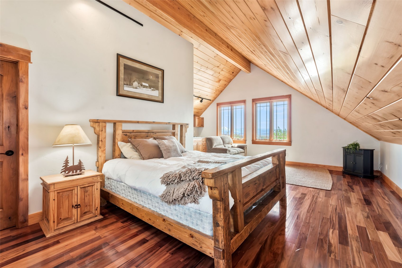 51193 Smith Creek Road Steamboat Springs, CO 80487 - Photo 23 of 48 a bedroom with a bed and a view of bathroom