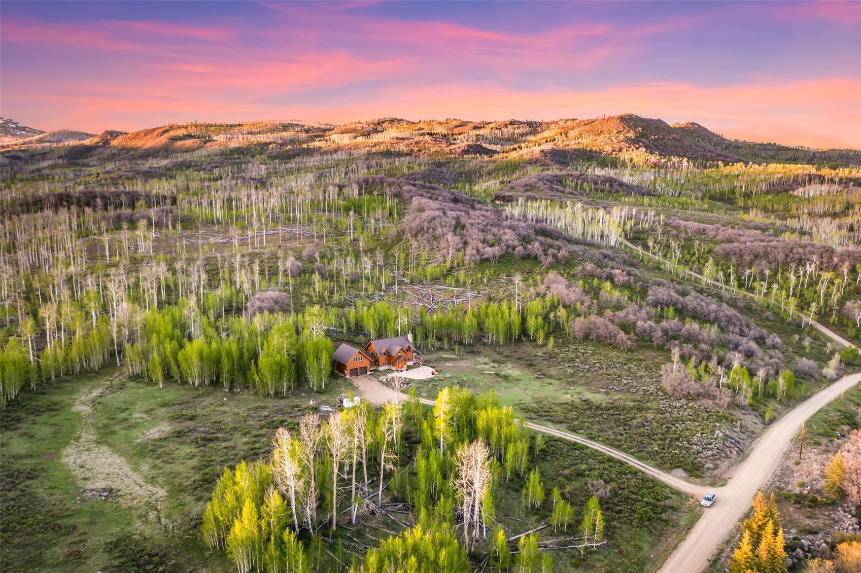 51193 Smith Creek Road Steamboat Springs, CO 80487 - Photo 3 of 48 a view of a lake with a mountain in the background