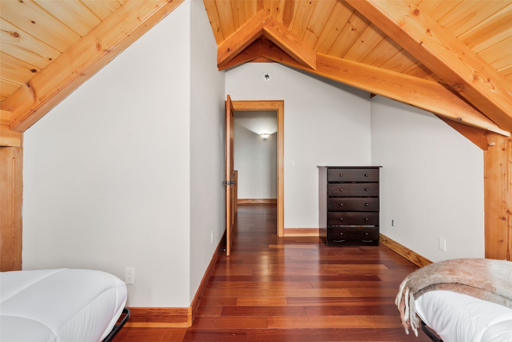 51193 Smith Creek Road Steamboat Springs, CO 80487 - Photo 32 of 48 a view of bedroom with furniture and wooden floor