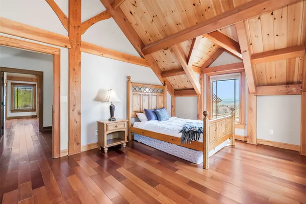 a bedroom with furniture and a window