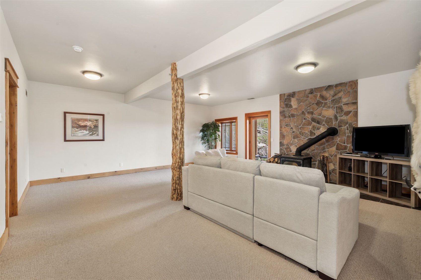 51193 Smith Creek Road Steamboat Springs, CO 80487 - Photo 36 of 48 a living room with furniture and a flat screen tv