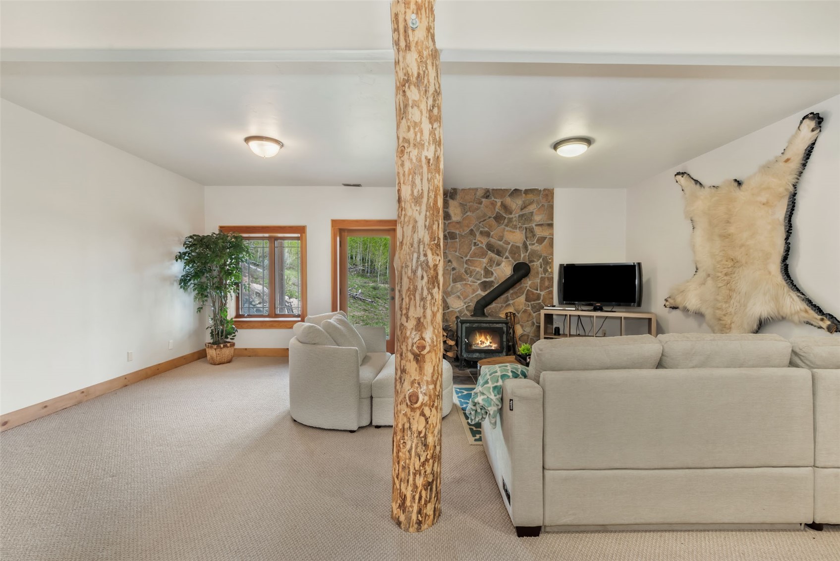 51193 Smith Creek Road Steamboat Springs, CO 80487 - Photo 38 of 48 a living room with furniture and a flat screen tv