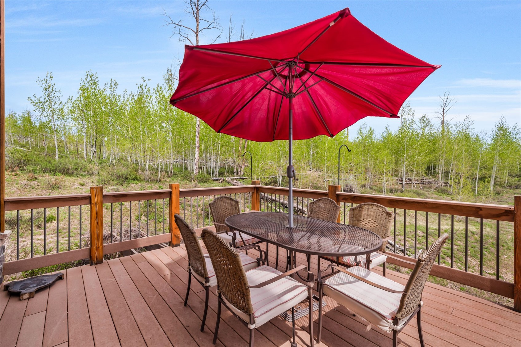 51193 Smith Creek Road Steamboat Springs, CO 80487 - Photo 43 of 48 a view of balcony with outdoor seating and wooden floor