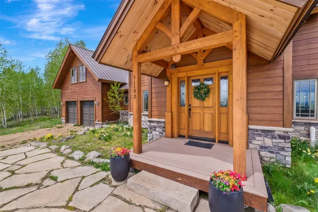 a view of a balcony with furniture and umbrella