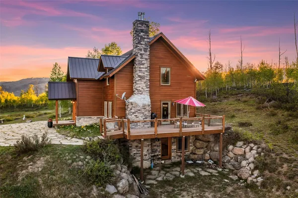 a view of house with outdoor space and seating area