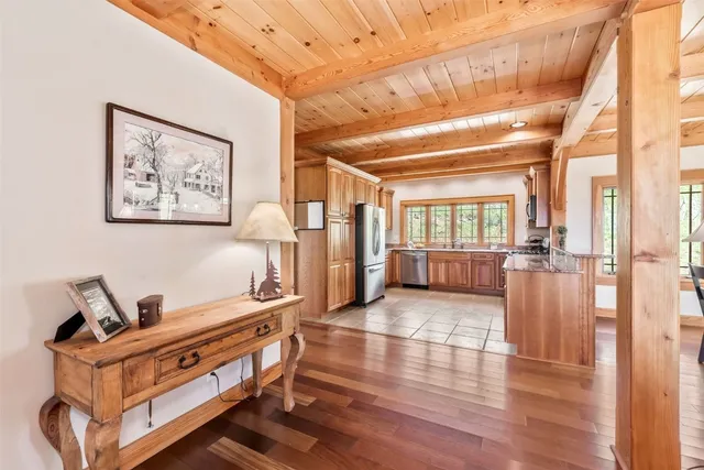 a view of an entryway with wooden floor