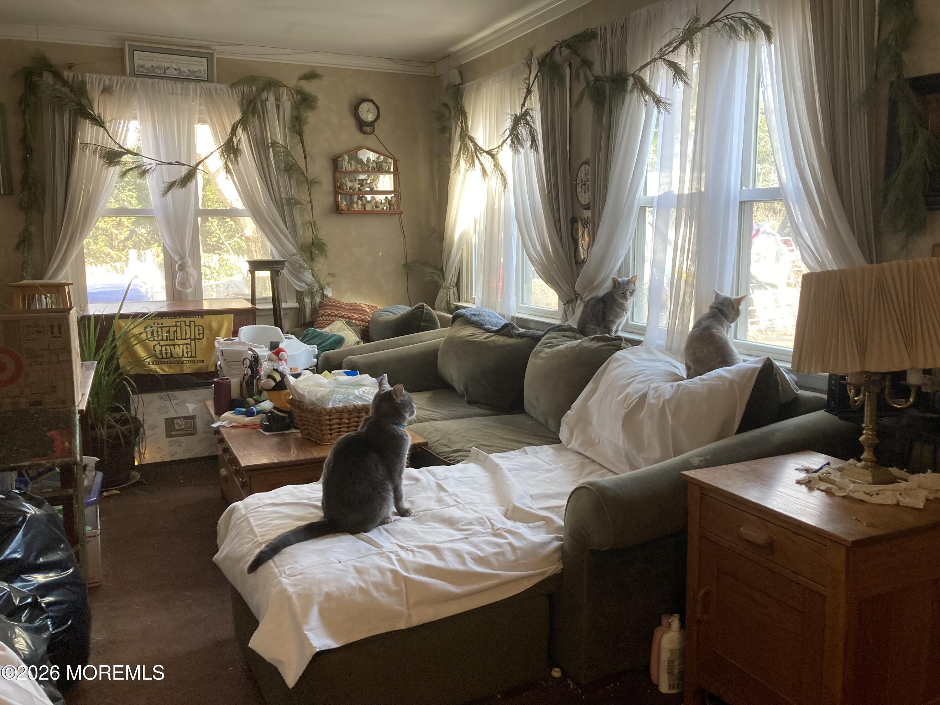 152 Chapel Hill Road Middletown, NJ 07701 - Photo 8 of 18 a living room with furniture and a large window