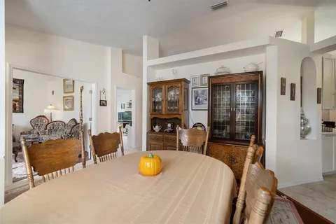 a bedroom with a bed a table and chair