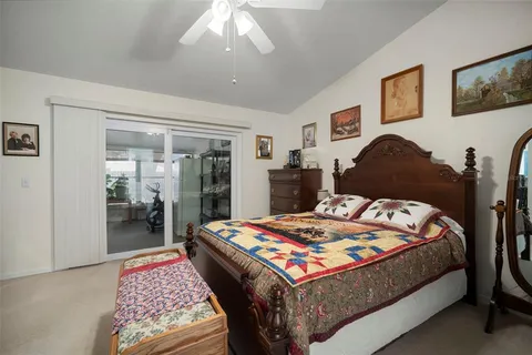 a bathroom with a granite countertop sink a mirror and shower