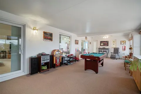 a view of a swimming pool with sitting area