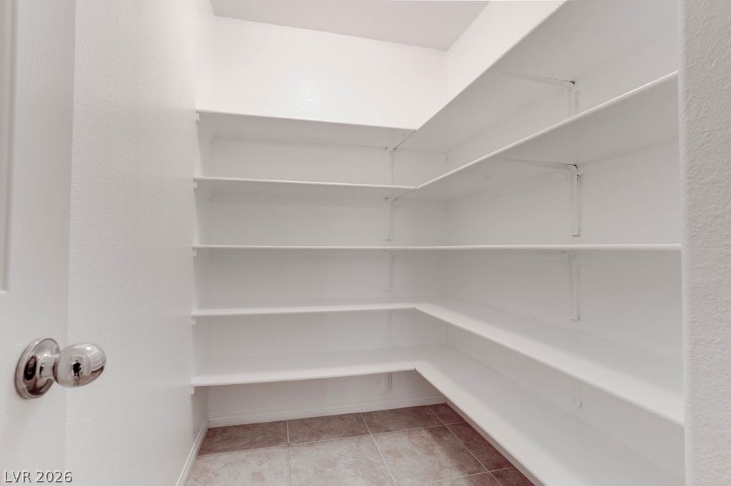 4650 Ranch House Road, Unit 47 North Las Vegas, NV 89031 - Photo 15 of 43 Ample shelving in this walk-in pantry provides generous storage space for kitchen essentials.