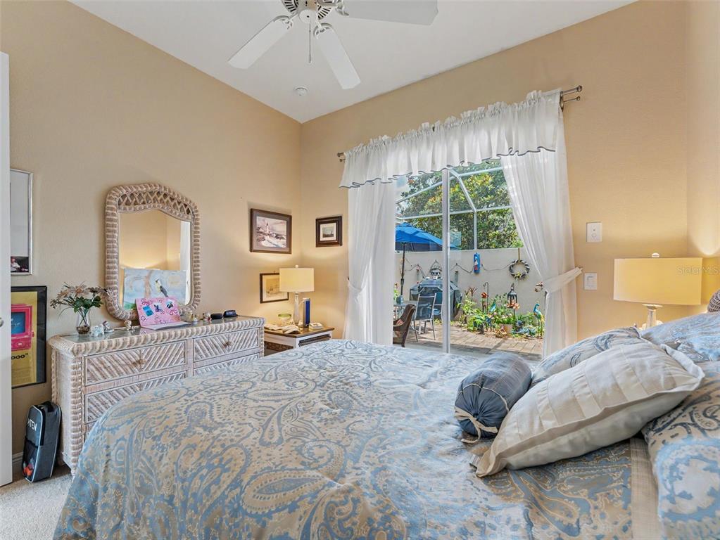 8910 Jericho Road Weeki Wachee, FL 34613 - Photo 40 of 52 a bedroom with furniture and a large window