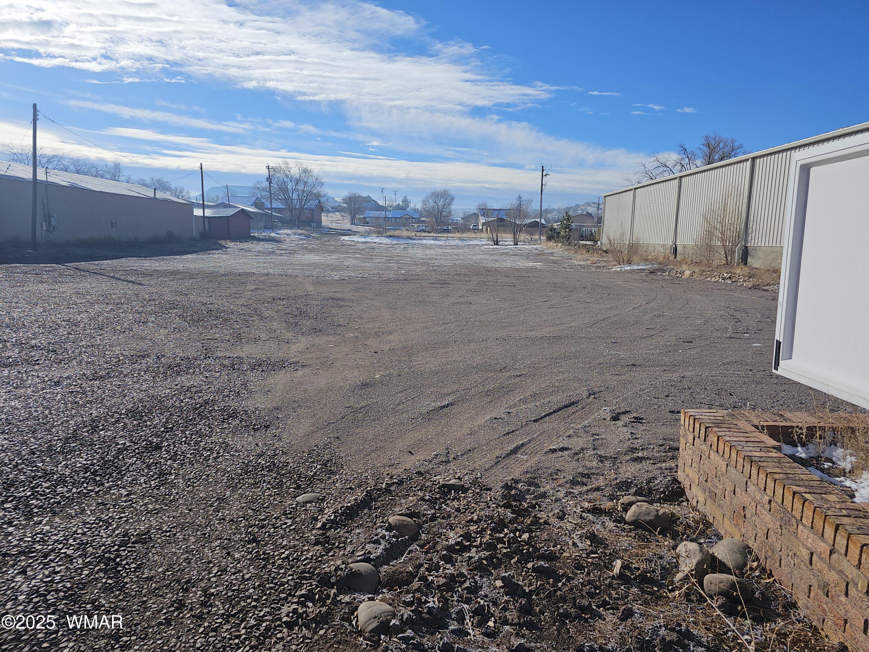 616 East Main Street Springerville, AZ 85938 - Photo 4 of 6 a view of a dry yard with wooden fence