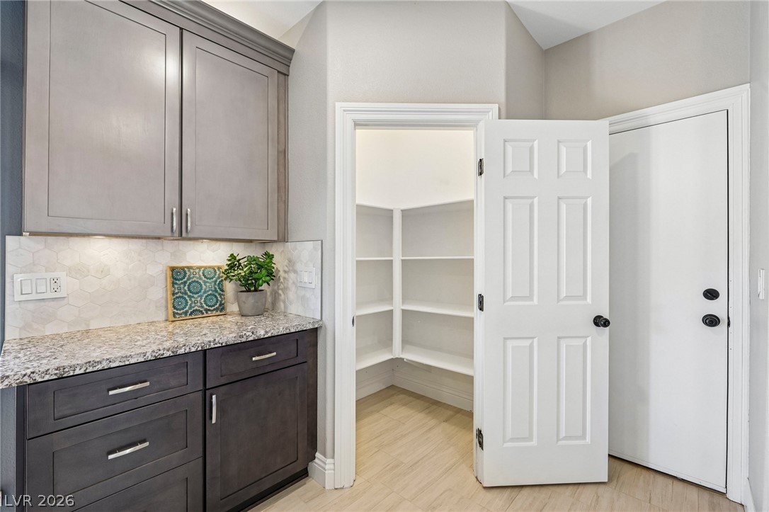 1176 Butternut Ranch Court Henderson, NV 89052 - Photo 15 of 60 Ample counter space and cabinet storage complement this inviting pantry area.