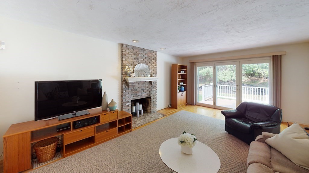 90 Cranberry Circle Sudbury, MA 01776 - Photo 14 of 37 a living room with furniture and a flat screen tv