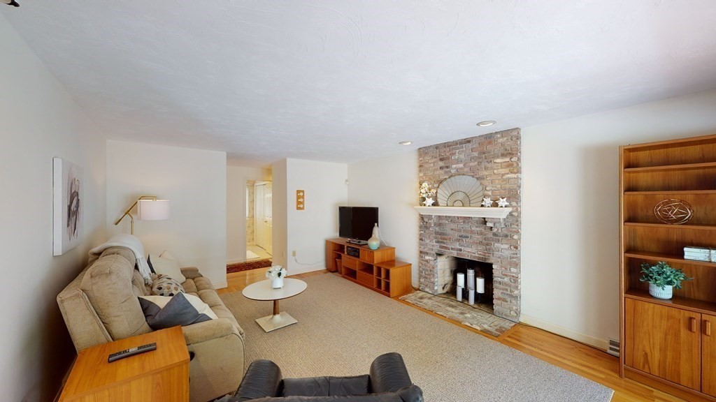 90 Cranberry Circle Sudbury, MA 01776 - Photo 15 of 37 a living room with furniture and a flat screen tv