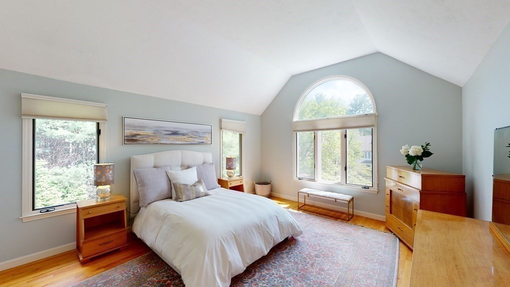 90 Cranberry Circle Sudbury, MA 01776 - Photo 19 of 37 a bedroom with a bed and wooden floor