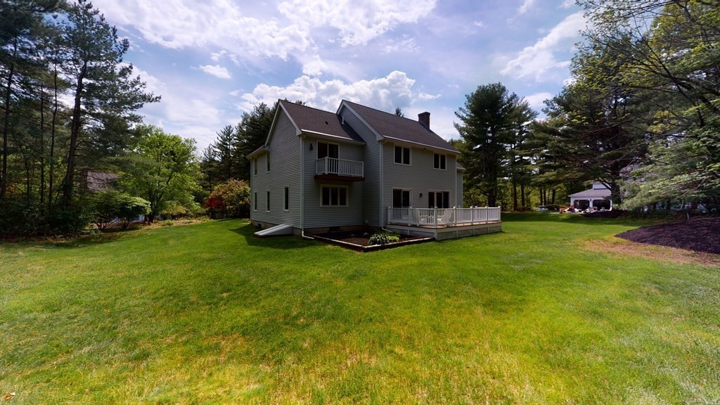 90 Cranberry Circle Sudbury, MA 01776 - Photo 2 of 37 a house view with a garden space