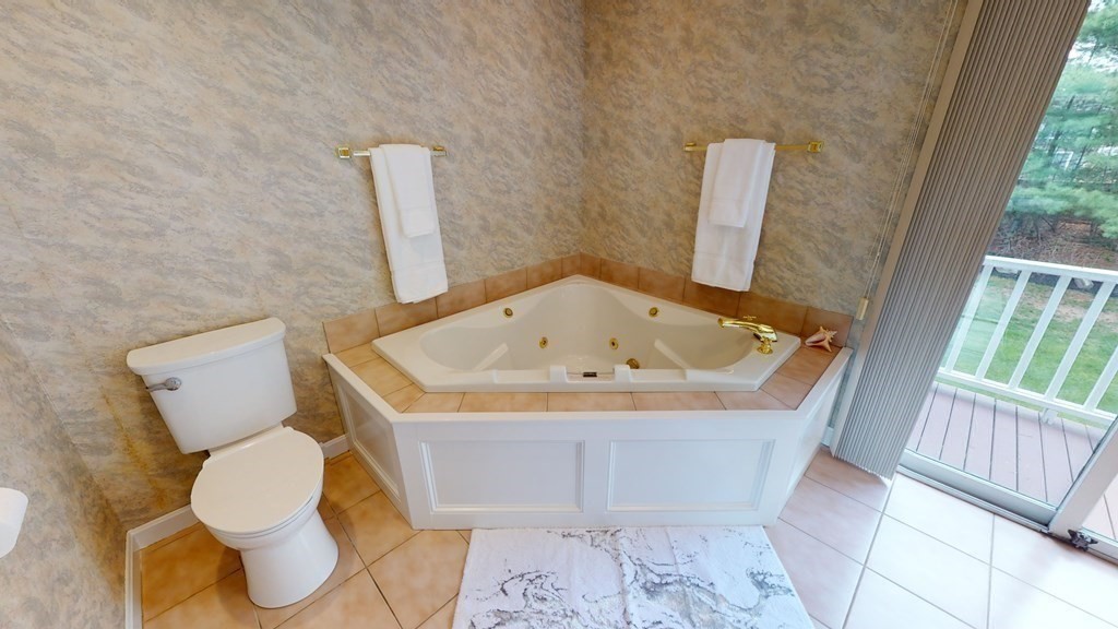 90 Cranberry Circle Sudbury, MA 01776 - Photo 22 of 37 a bathroom with a toilet and sink