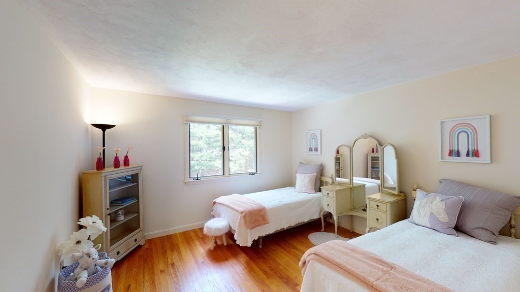 90 Cranberry Circle Sudbury, MA 01776 - Photo 23 of 37 a bedroom with two beds and a window