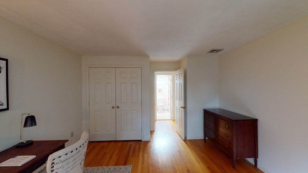 90 Cranberry Circle Sudbury, MA 01776 - Photo 26 of 37 an empty room with wooden floor and cabinet