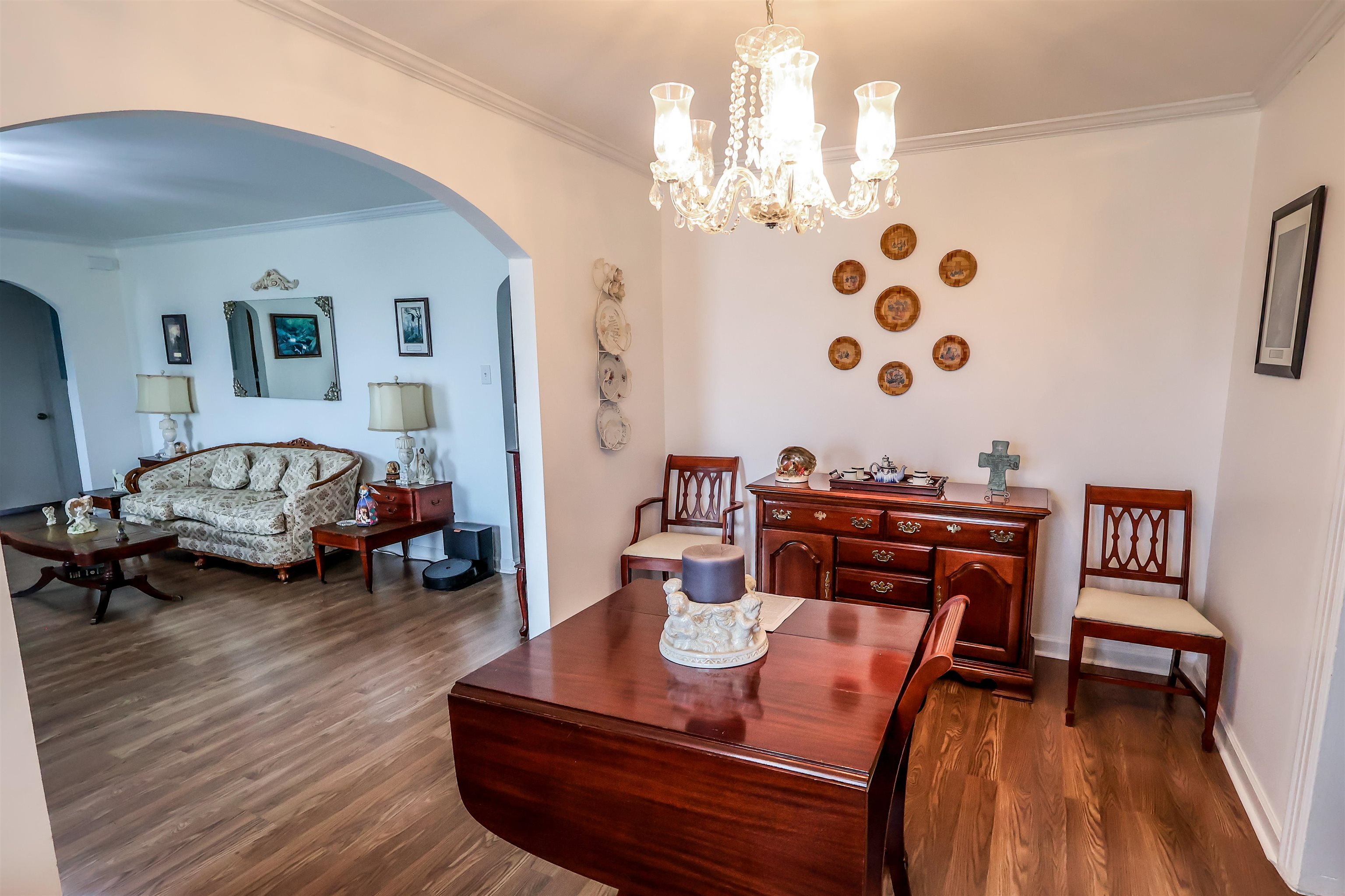 7840 Munford Giltedge Road Burlison, TN 38015 - Photo 12 of 20 a living room with furniture and a chandelier