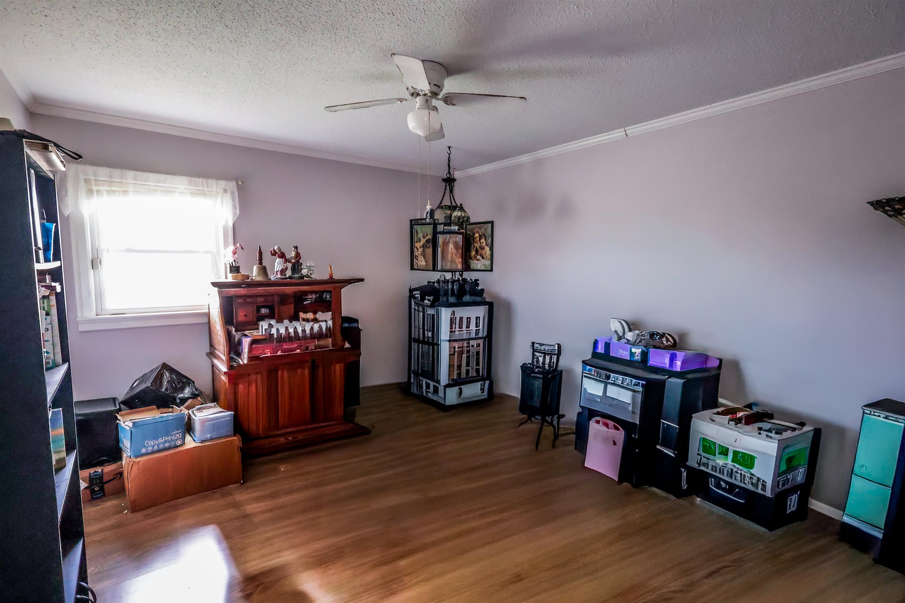 7840 Munford Giltedge Road Burlison, TN 38015 - Photo 16 of 20 a living room with furniture and a wooden floor