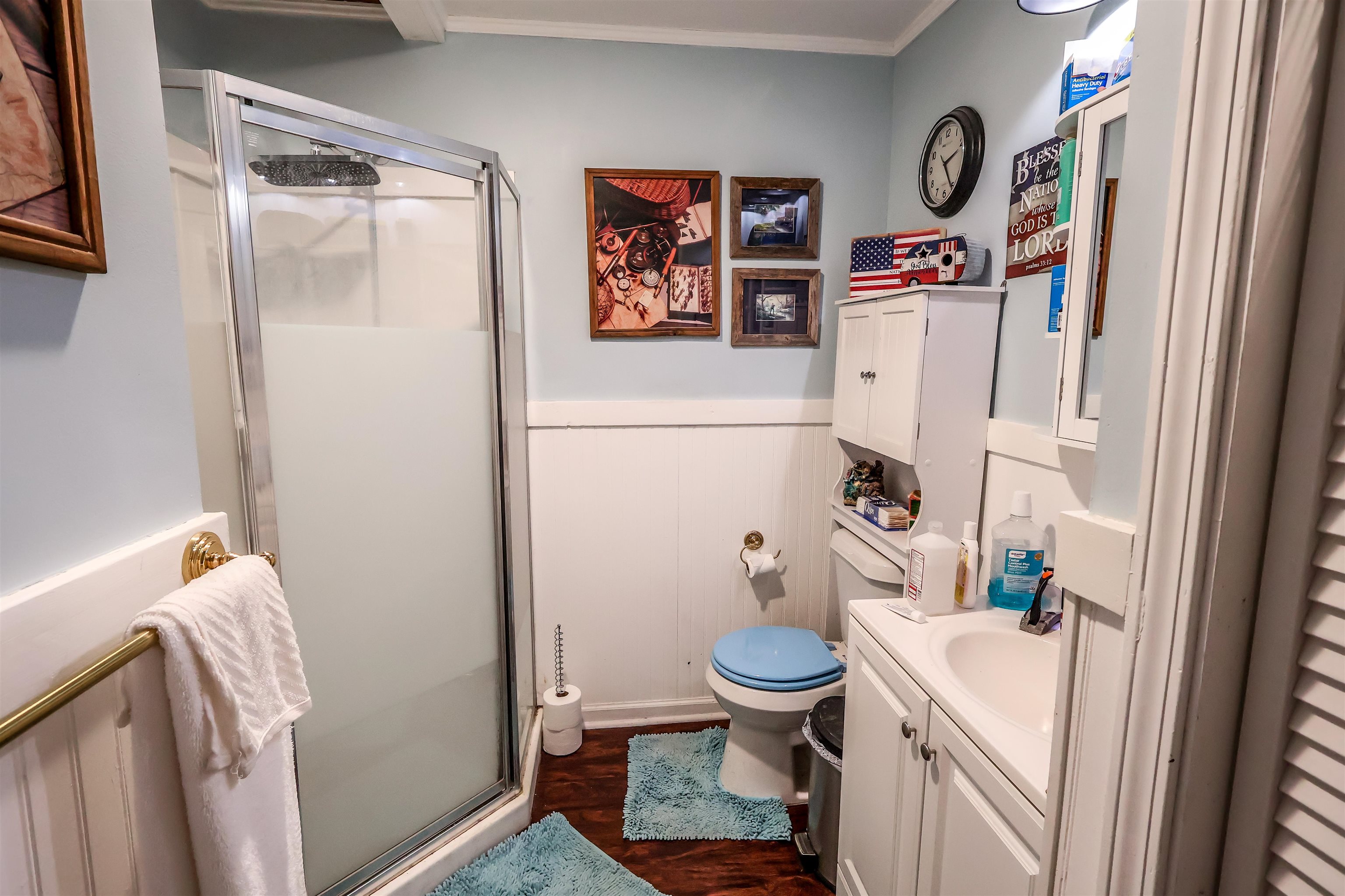 7840 Munford Giltedge Road Burlison, TN 38015 - Photo 17 of 38 a bathroom with a sink toilet and shower