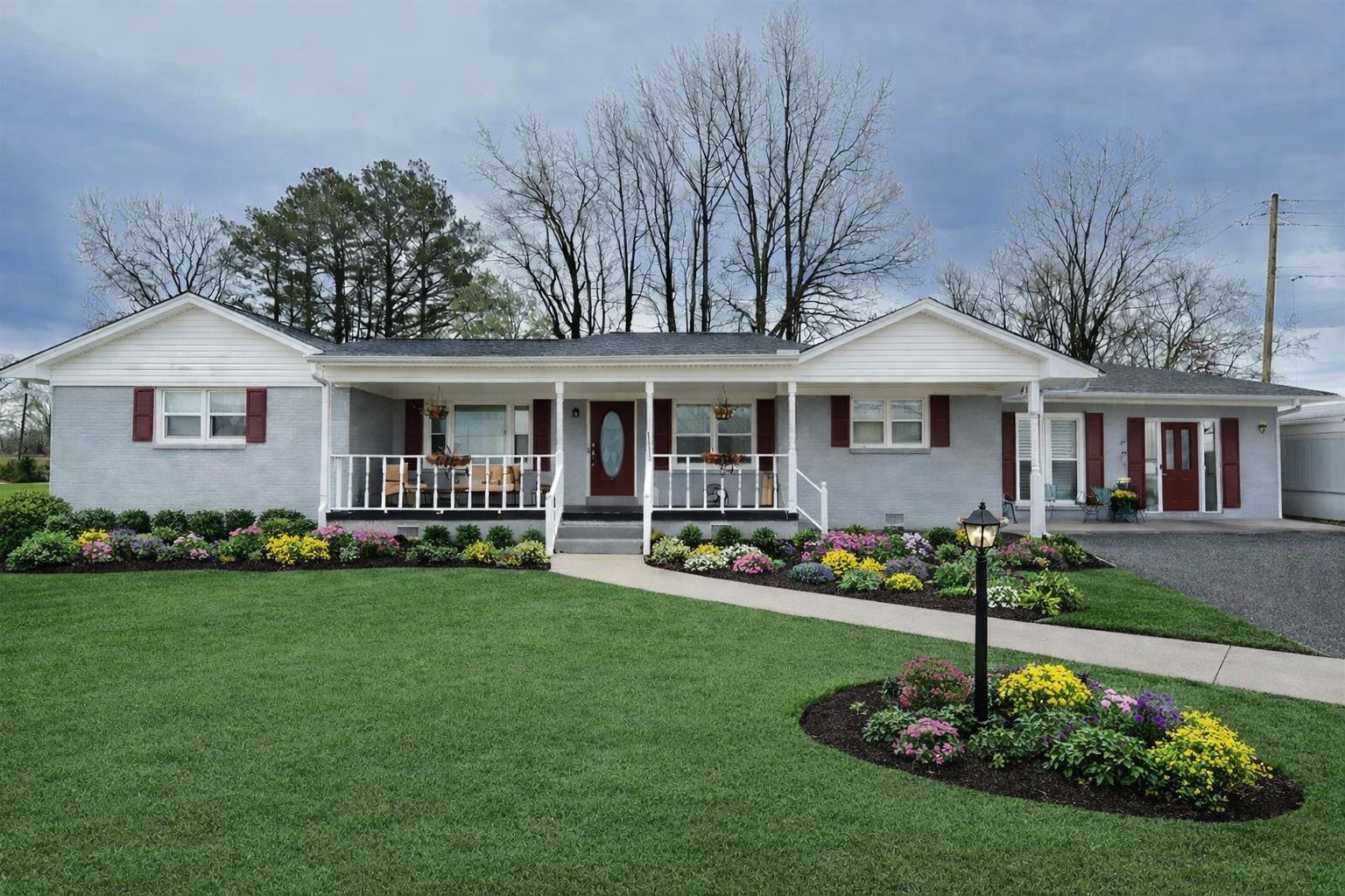 7840 Munford Giltedge Road Burlison, TN 38015 - Photo 2 of 38 a front view of a house with a yard table and chairs