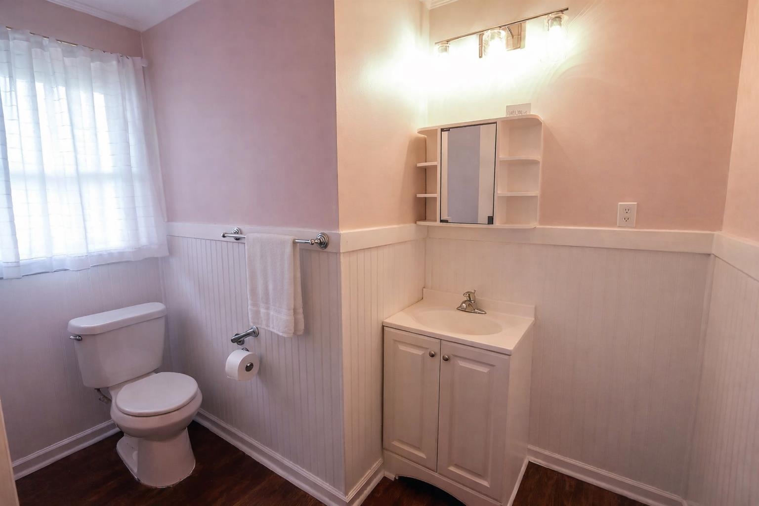 7840 Munford Giltedge Road Burlison, TN 38015 - Photo 21 of 38 a bathroom with a sink mirror and toilet