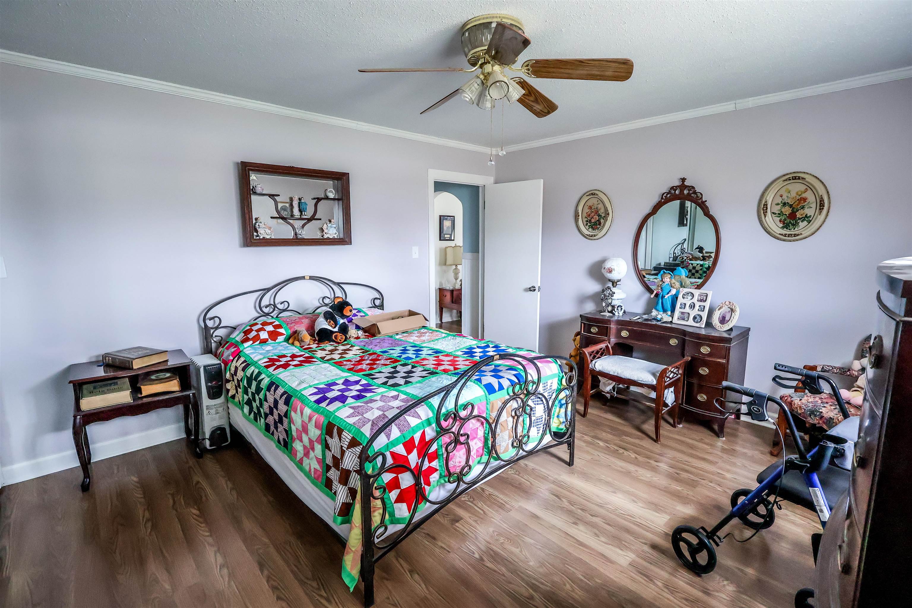 7840 Munford Giltedge Road Burlison, TN 38015 - Photo 26 of 38 Bedroom with wood finished floors, ceiling fan, and ornamental molding