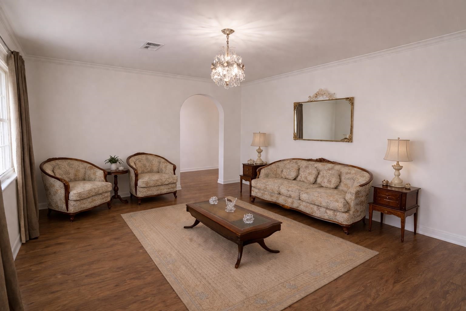 7840 Munford Giltedge Road Burlison, TN 38015 - Photo 35 of 38 a living room with furniture and a chandelier