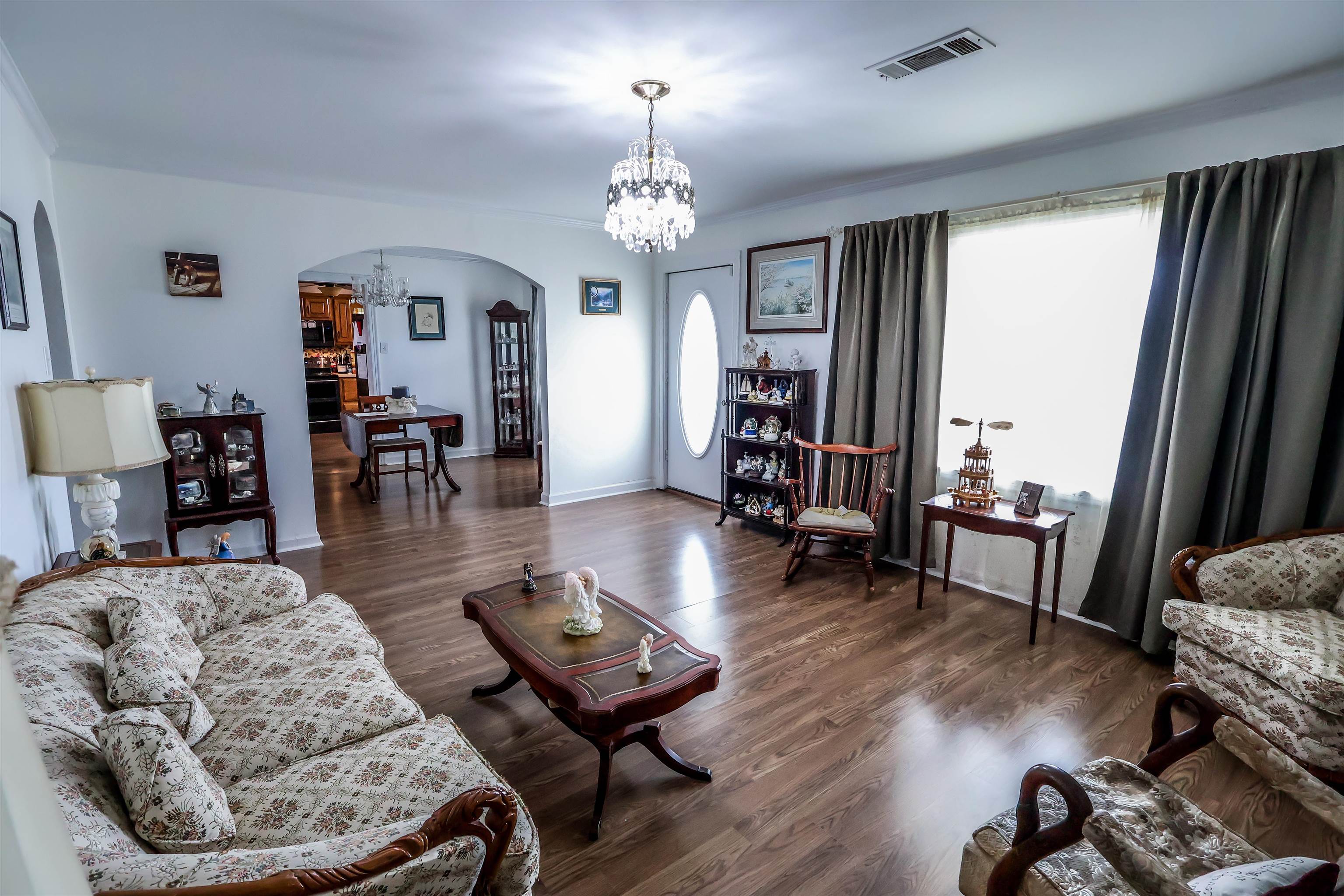 7840 Munford Giltedge Road Burlison, TN 38015 - Photo 36 of 38 a living room with furniture and a chandelier