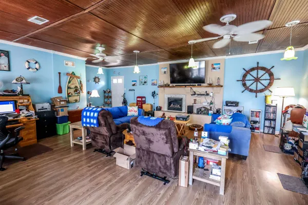 a living room with lots of furniture and a flat screen tv