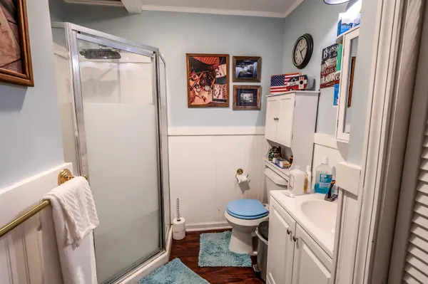 a bathroom with a sink toilet and shower