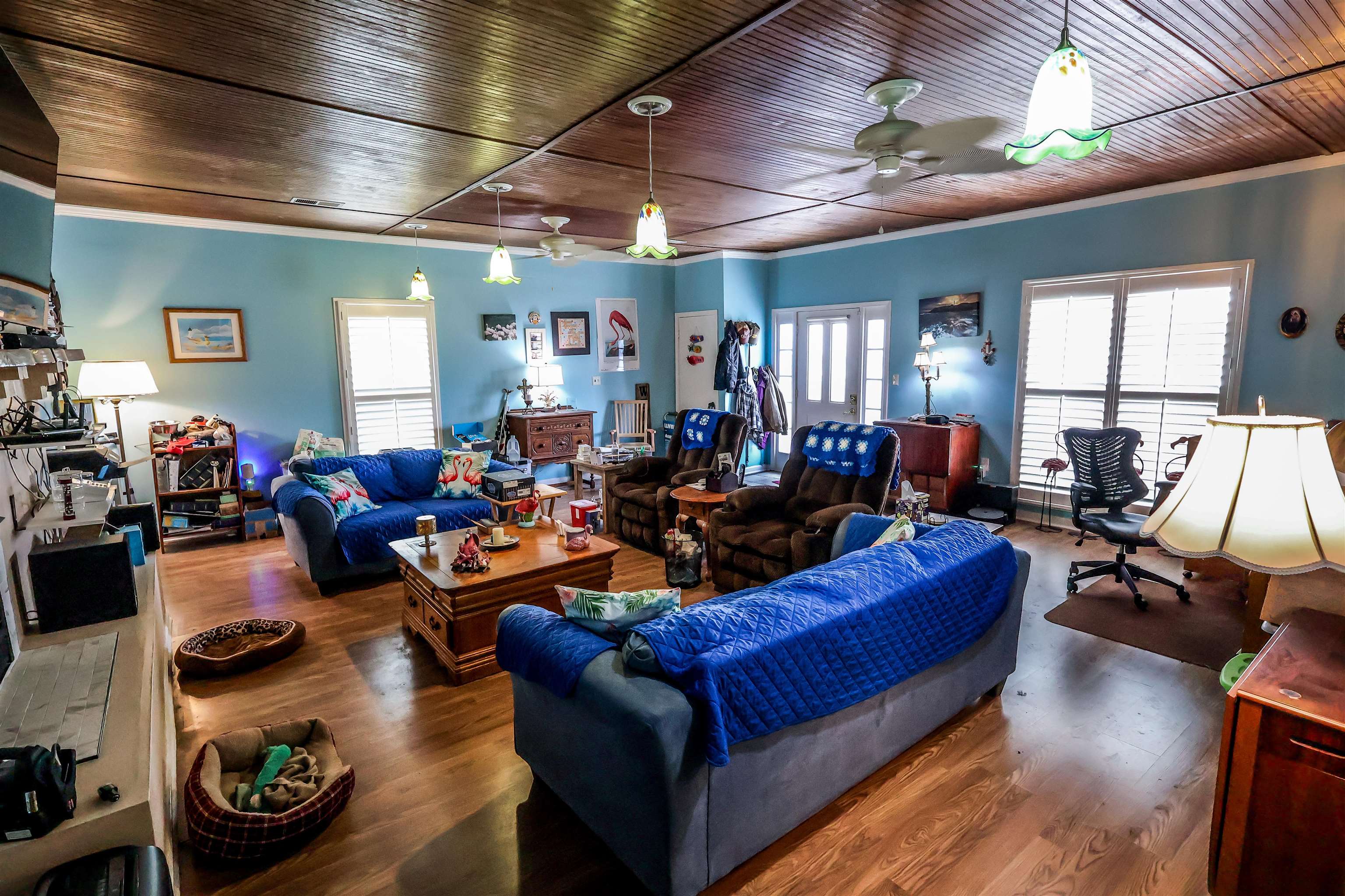 7840 Munford Giltedge Road Burlison, TN 38015 - Photo 9 of 38 Living room featuring wood finished floors, a ceiling fan, wooden ceiling, and ornamental molding. Photo is AI generated