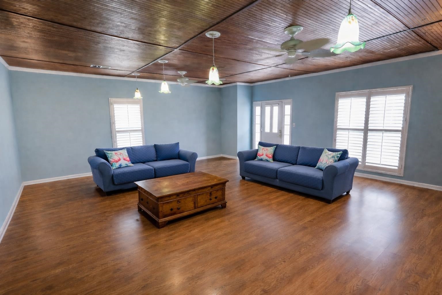 7840 Munford Giltedge Road Burlison, TN 38015 - Photo 10 of 38 Living area with wooden ceiling, wood finished floors, ornamental molding, plenty of natural light, and a ceiling fan. Photo is AI generated