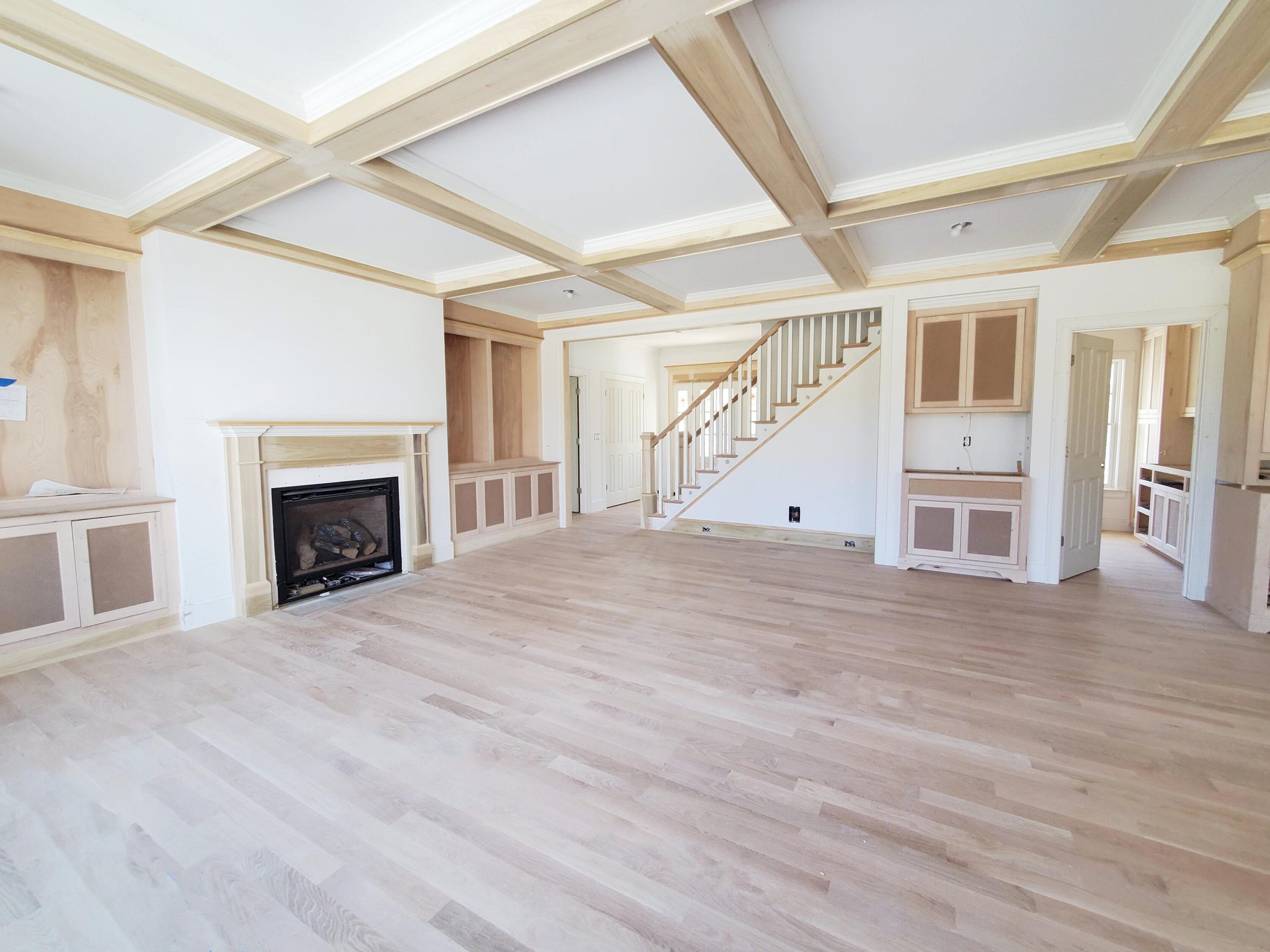 3 Snow Way Orleans, MA 02653 - Photo 14 of 33 a view of an empty room with wooden floor fireplace and a window